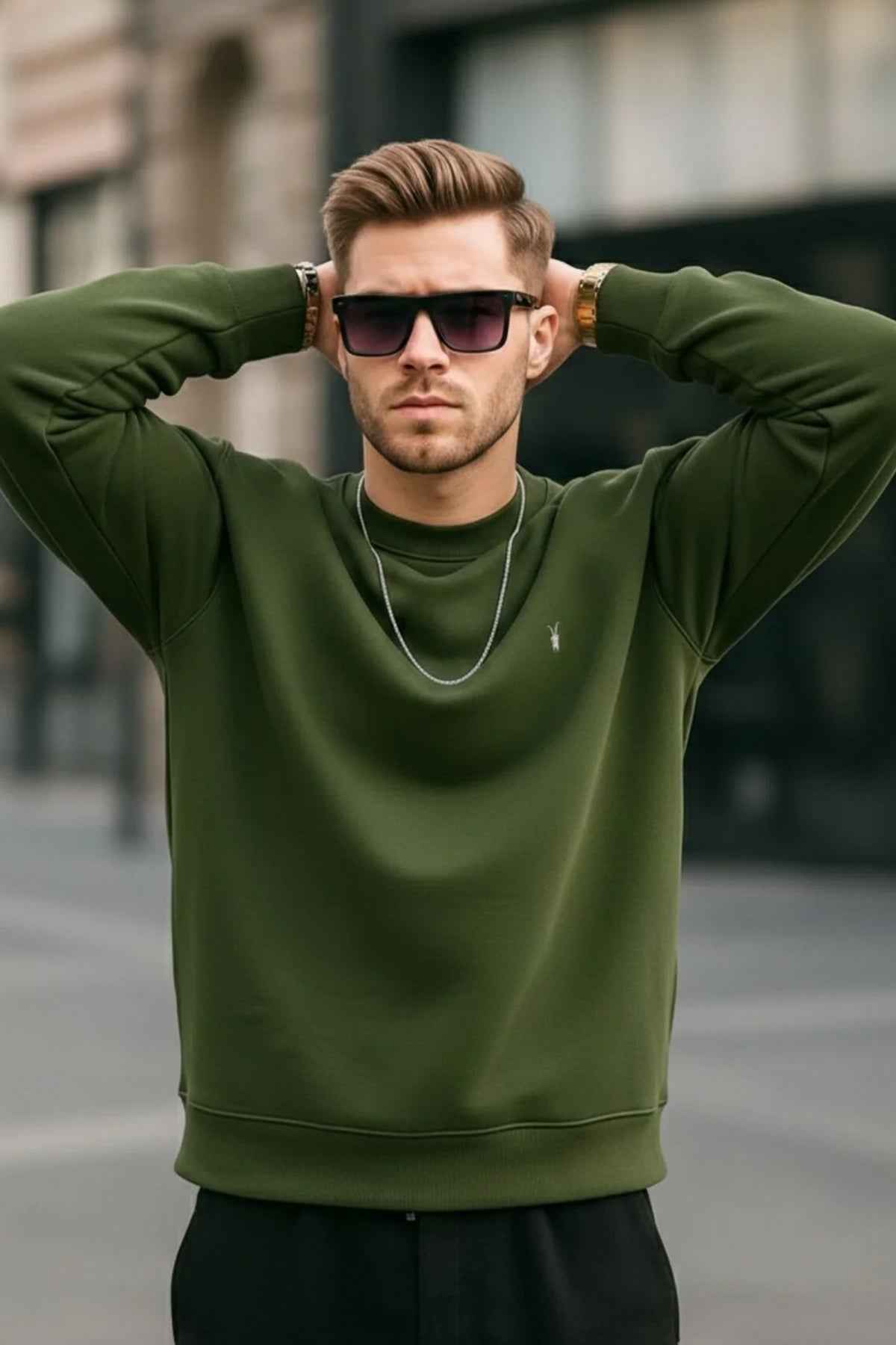 Men's crewneck sweatshirt with ribbed cuffs and hem; hands on head, small chest logo