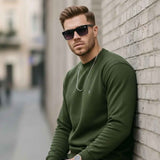 Men's crewneck sweatshirt with ribbed cuffs and hem, small chest logo, side view
