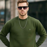 Men's crewneck sweatshirt with long sleeves and ribbed hem, small chest logo, front view