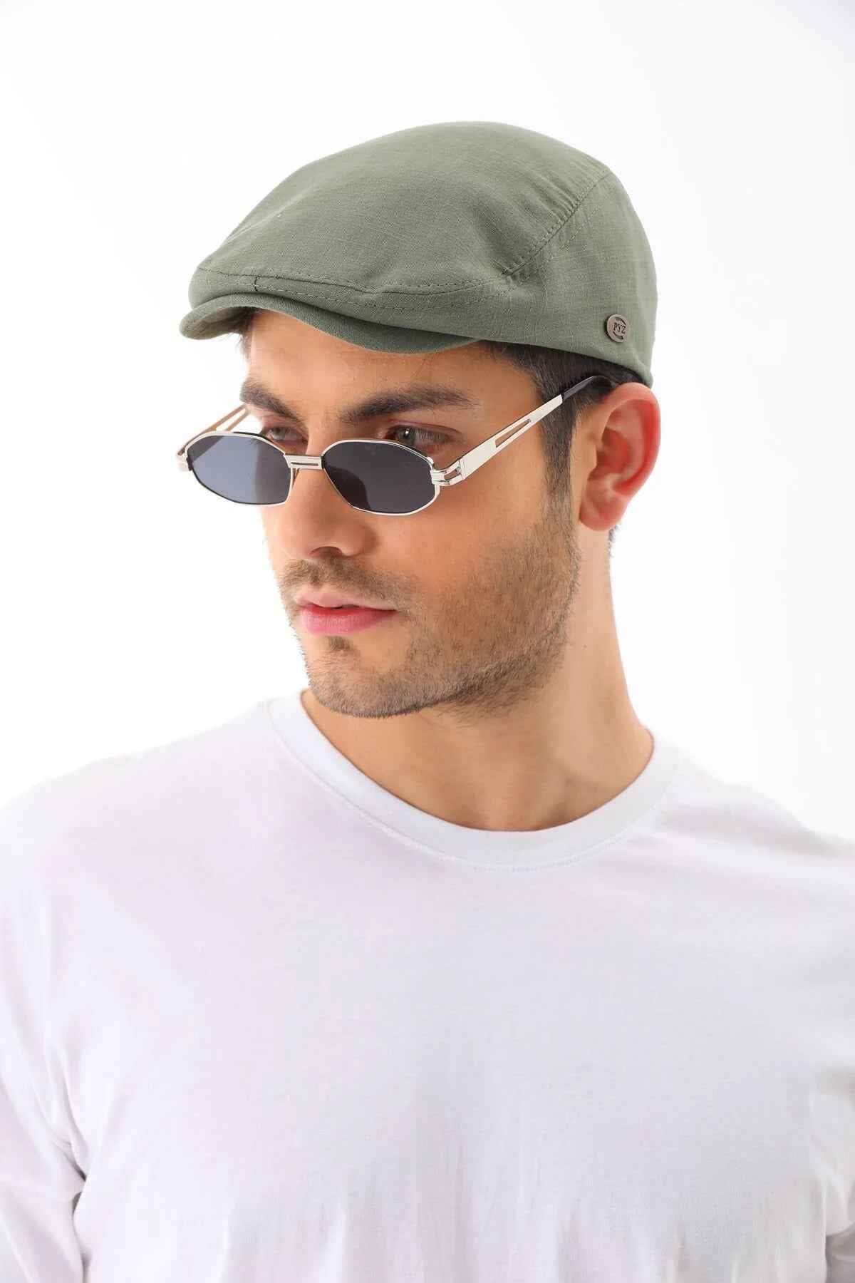 Men's khaki flat cap by Ritag, side view, curved brim and small logo badge