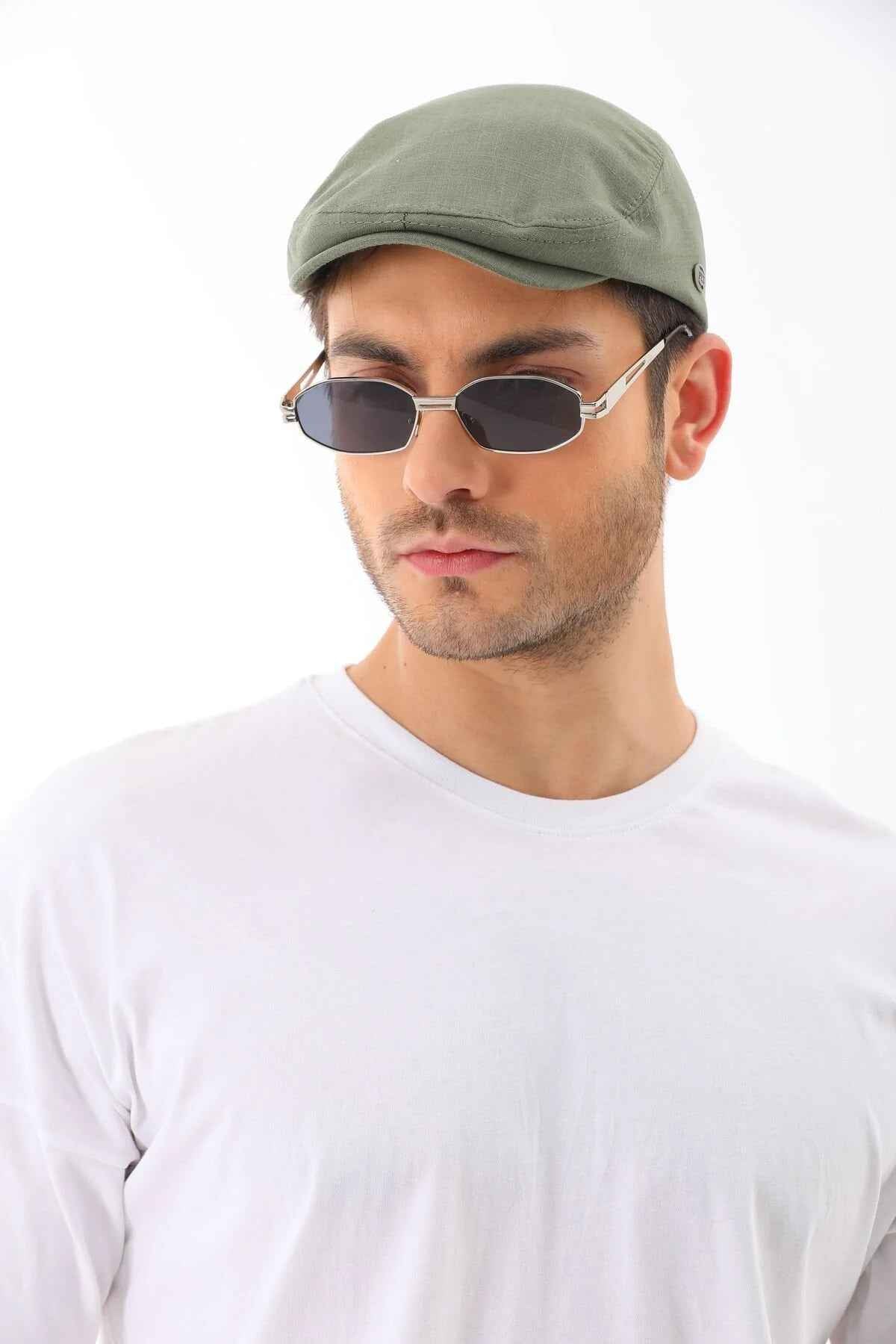 Men's khaki flat cap by Ritag, front three-quarter view, curved brim and seam detail