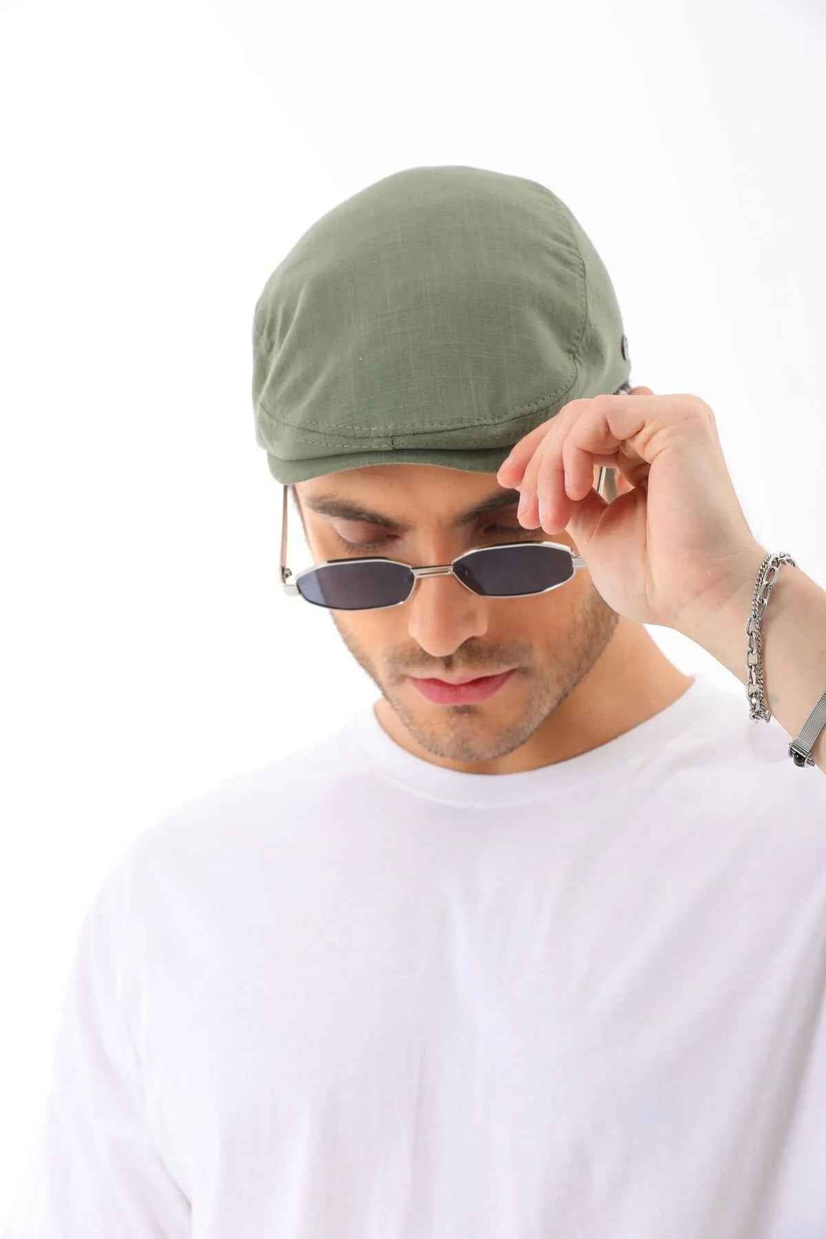 Men's khaki flat cap by Ritag, front view, curved brim and stitched crown