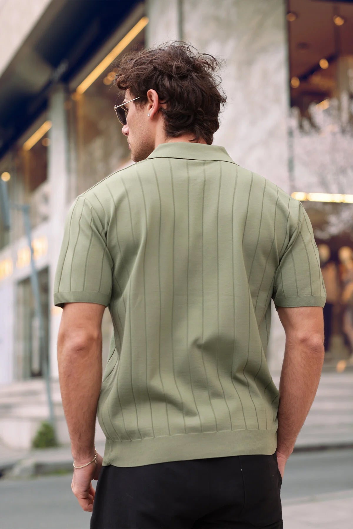 Men's olive half-zip knit polo shirt, short sleeves, back view