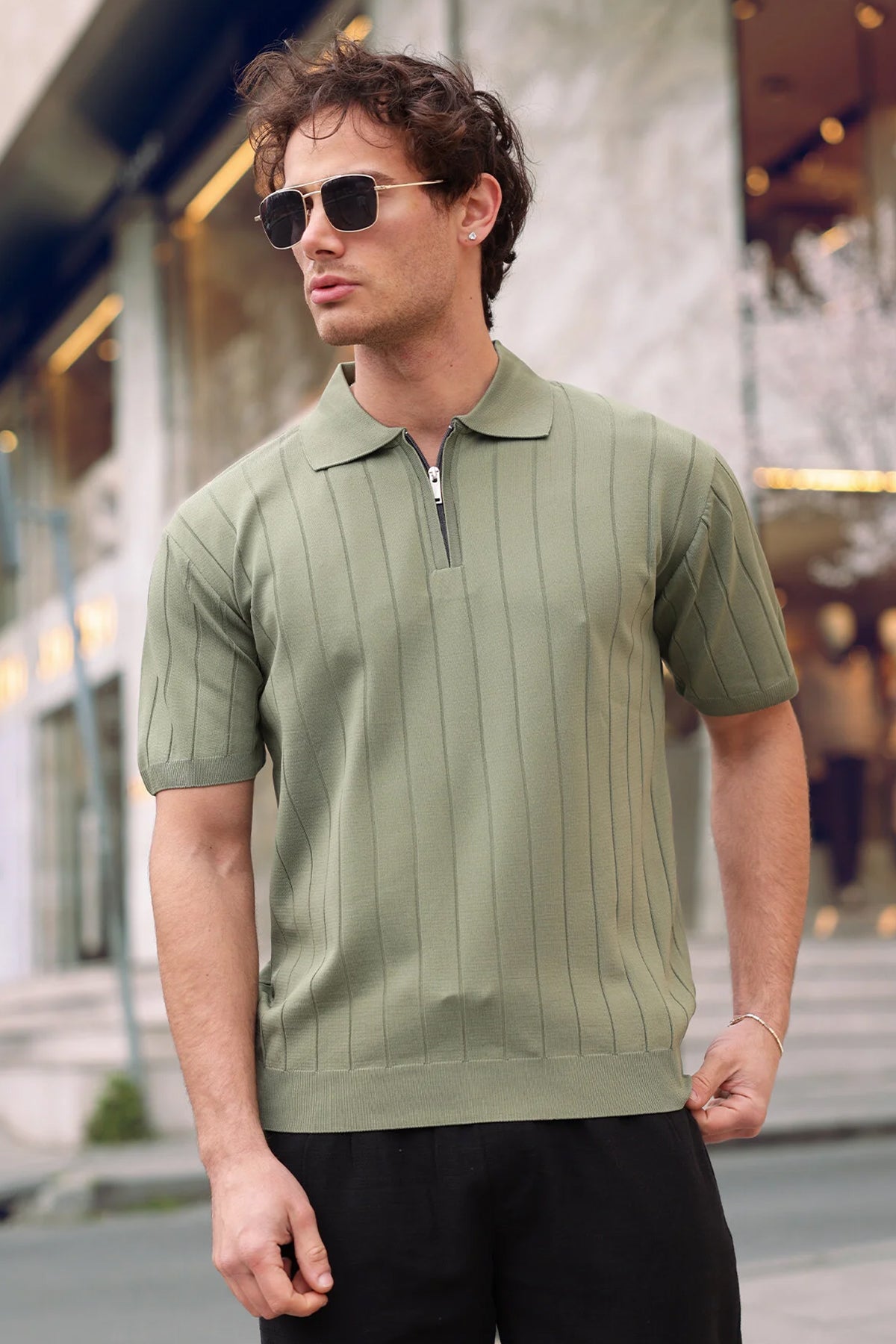Men's olive half-zip knit polo shirt with polo collar and zip front