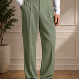 Men's olive dress pants with black belt, pleated waist, and straight legs