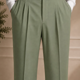 Men's olive dress pants close-up: pleated front and black belt with buckle