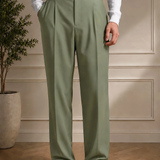 Men's olive dress pants with black belt and front pleats, full-length