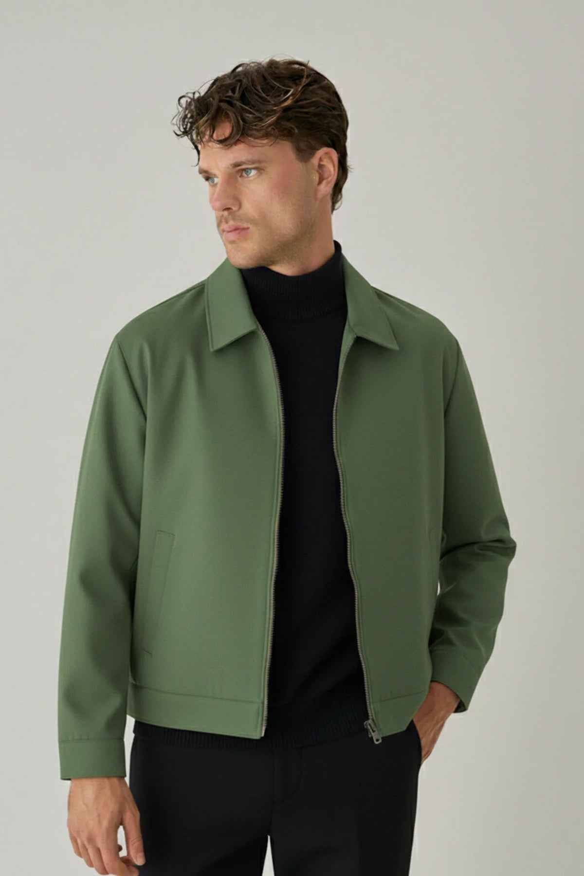 Men's green jacket with zip closure and pointed collar, front view