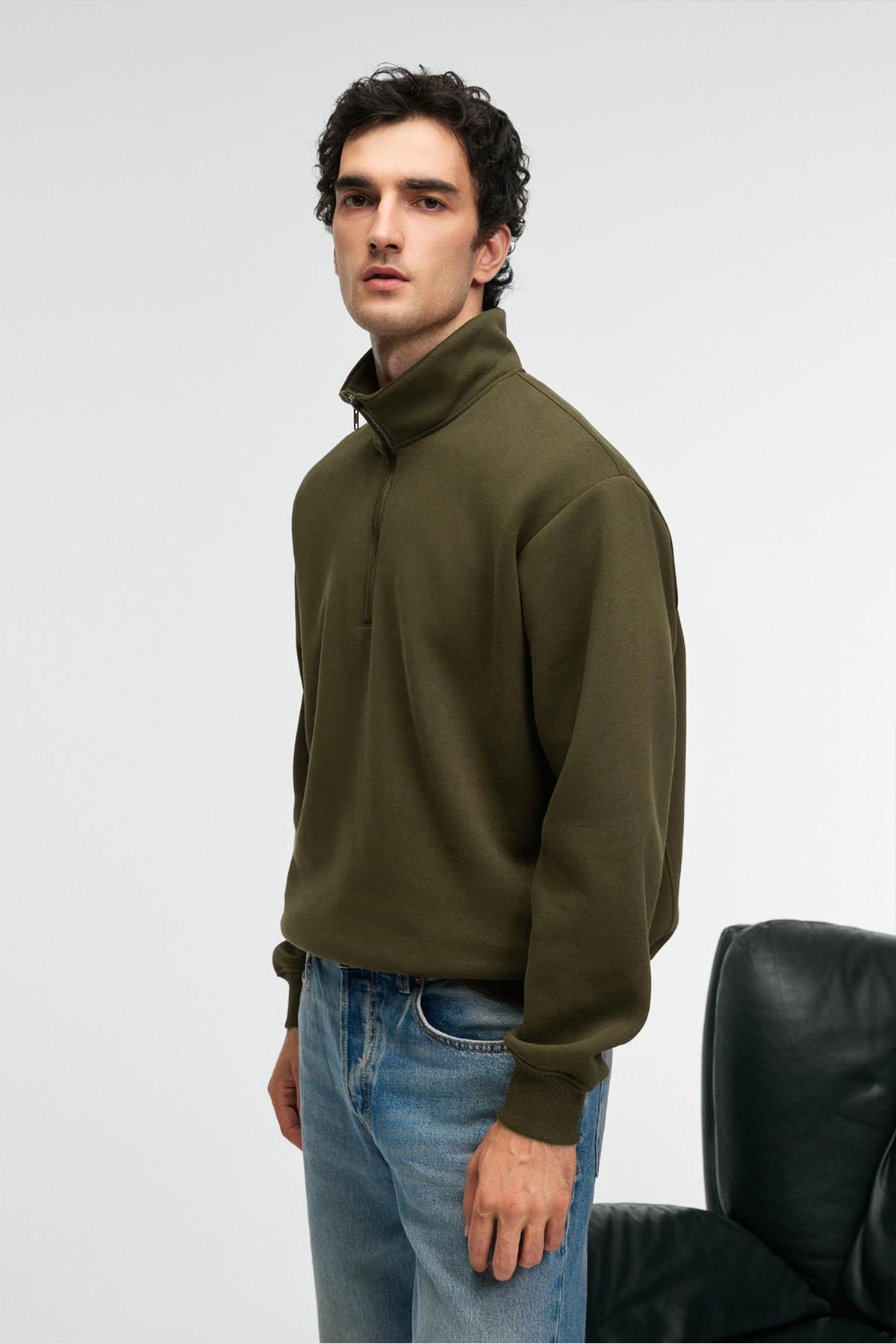 Olive zip stand-collar sweatshirt, relaxed fit, side profile