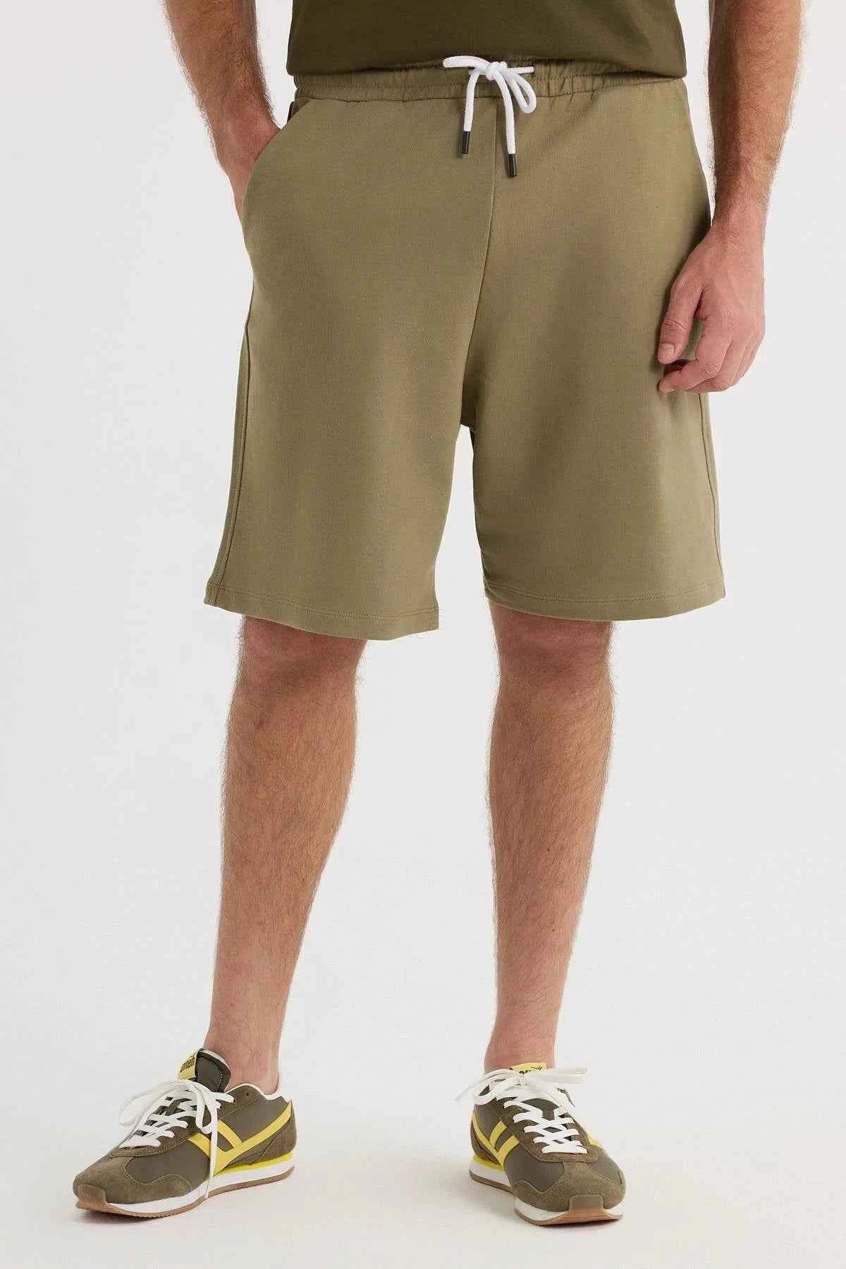 Men's olive khaki shorts with white drawstring waistband