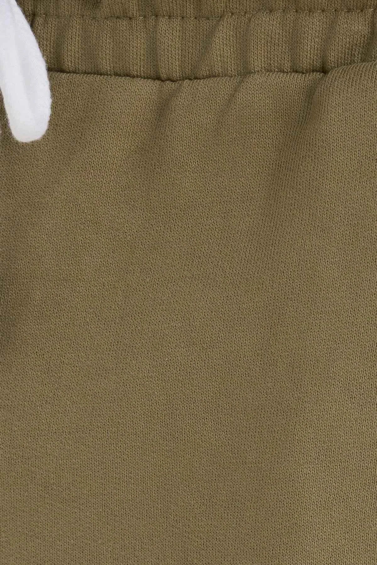 Olive khaki shorts fabric close-up showing textured weave