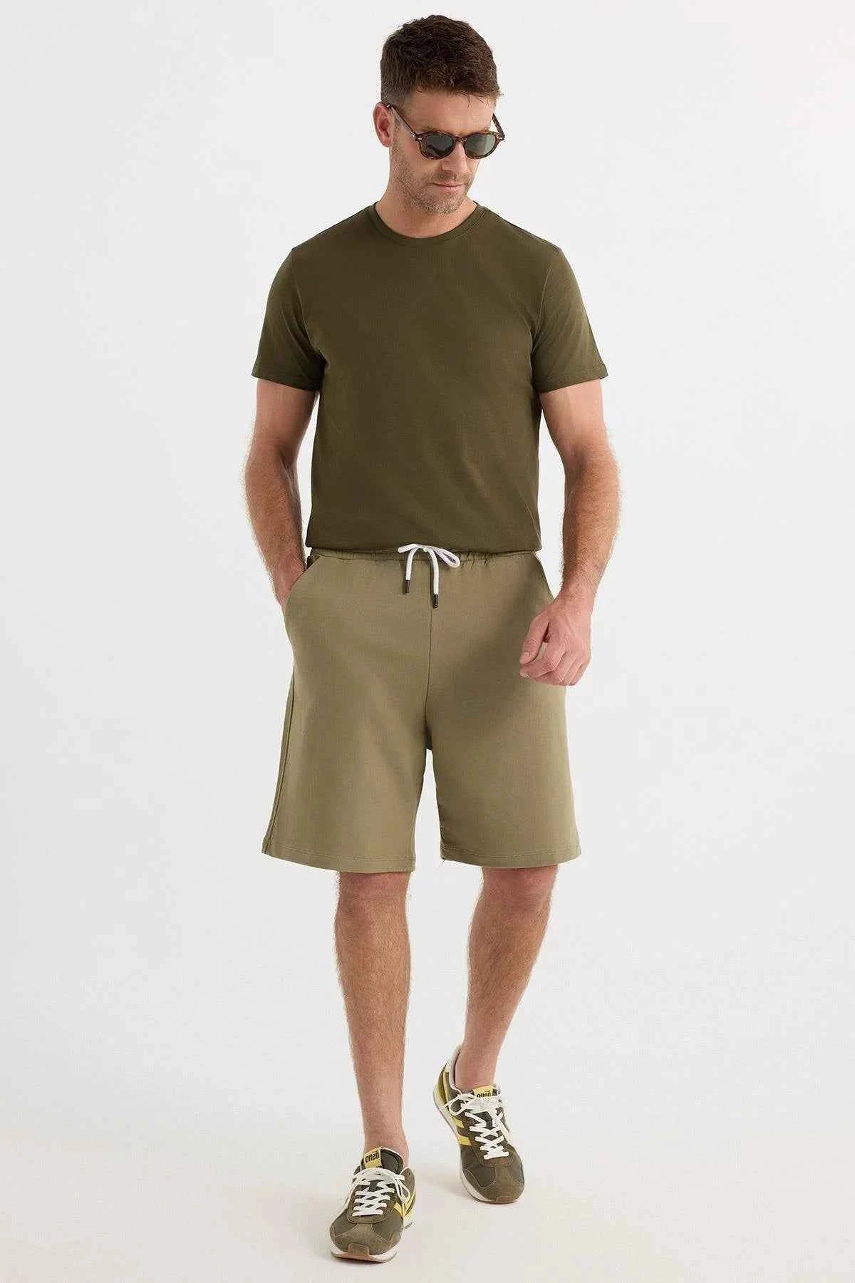 Men's olive khaki shorts with white drawstring, casual knee-length fit