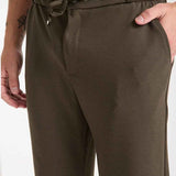 Olive sweatpants with elastic waistband, drawstring, side seam pockets
