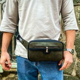 Men's khaki tablet bag with front zipper pocket and adjustable crossbody strap