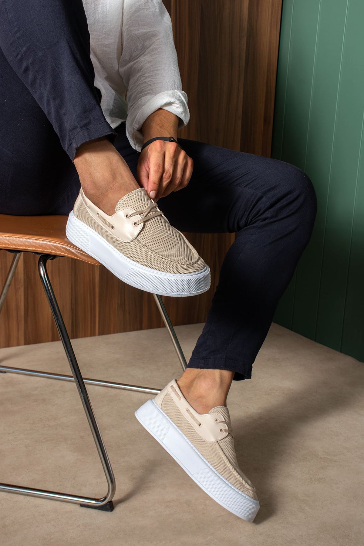 Beige knit lace-up sneakers with white rubber sole, side view
