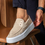 Beige knit lace-up sneaker with white sole, close side angle