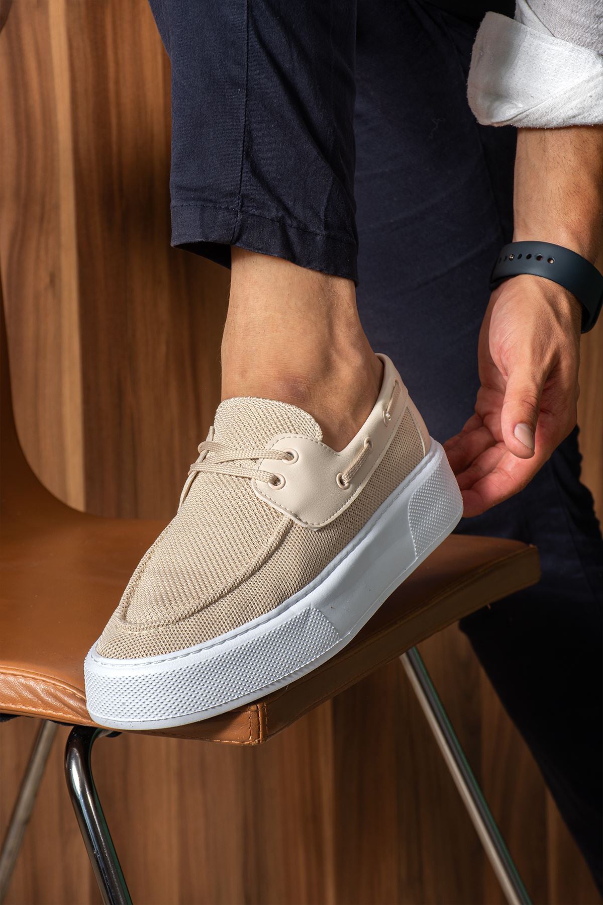 Beige knit lace-up sneaker with white sole, close side angle