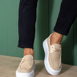 Beige knit lace-up sneakers with white sole, rear quarter view