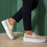 Beige knit lace-up sneakers with white sole, step motion side view