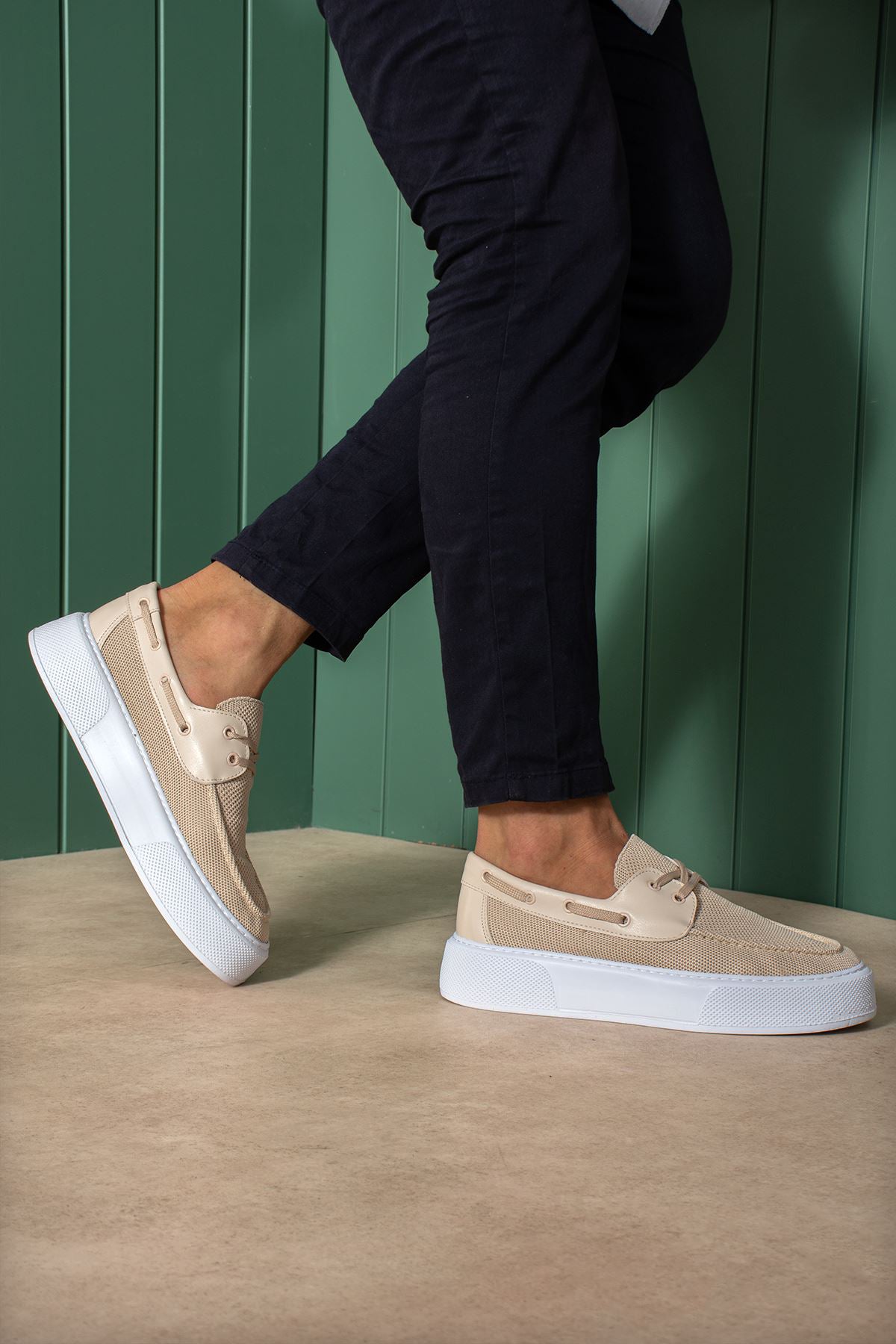 Beige knit lace-up sneakers with white sole, step motion side view