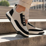 Men's knit sneakers in beige with black side stripes, cushioned sole