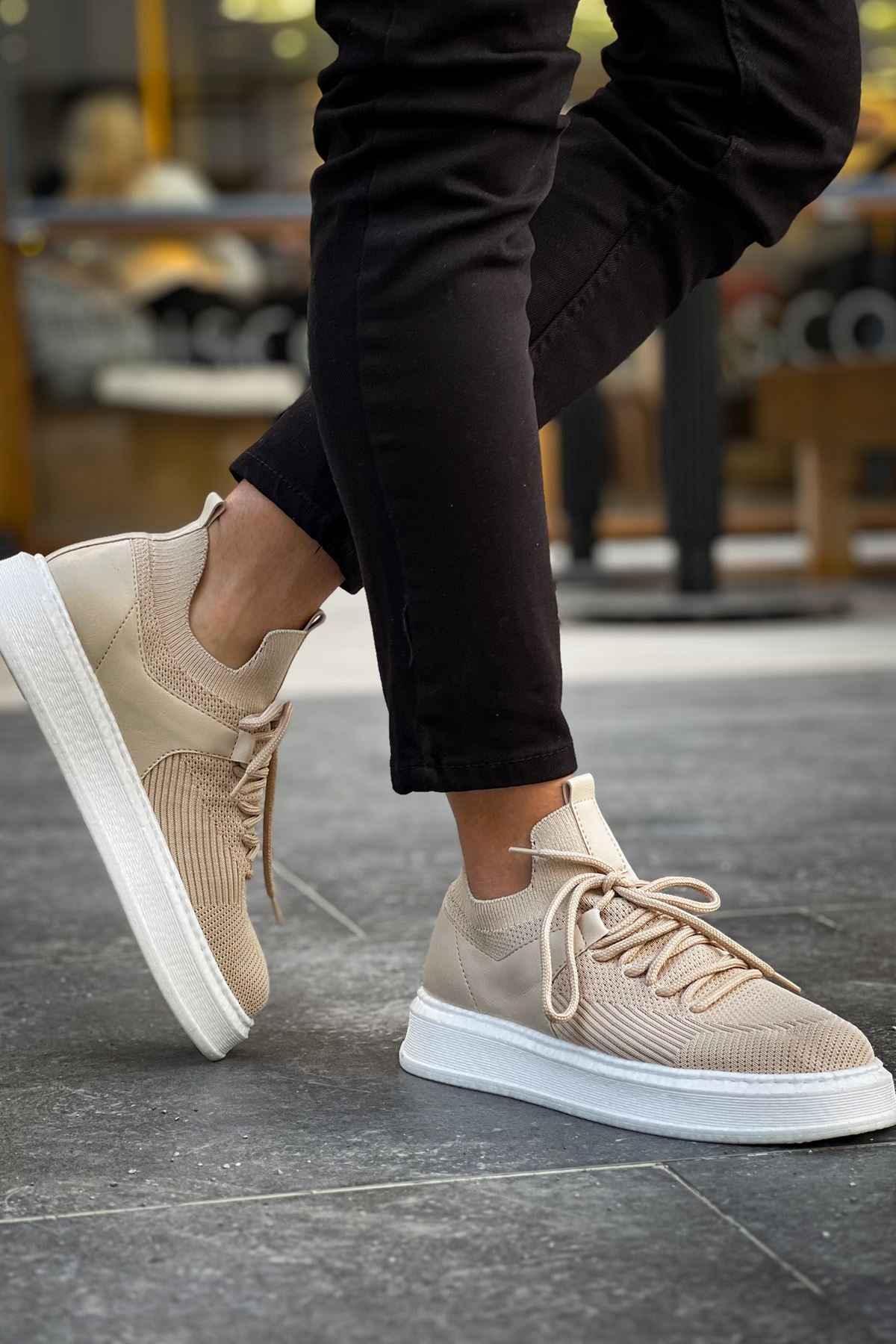 Beige knit sneakers with lace-up design and white sole, low side angle