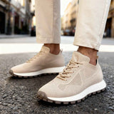 Beige knit men’s sneakers with lace-up front and cushioned sole