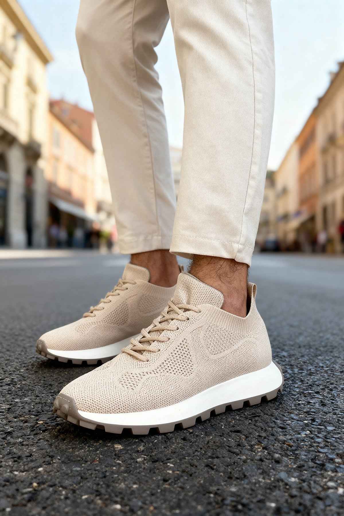 Beige lace-up knit sneakers with rubber outsole and textured upper