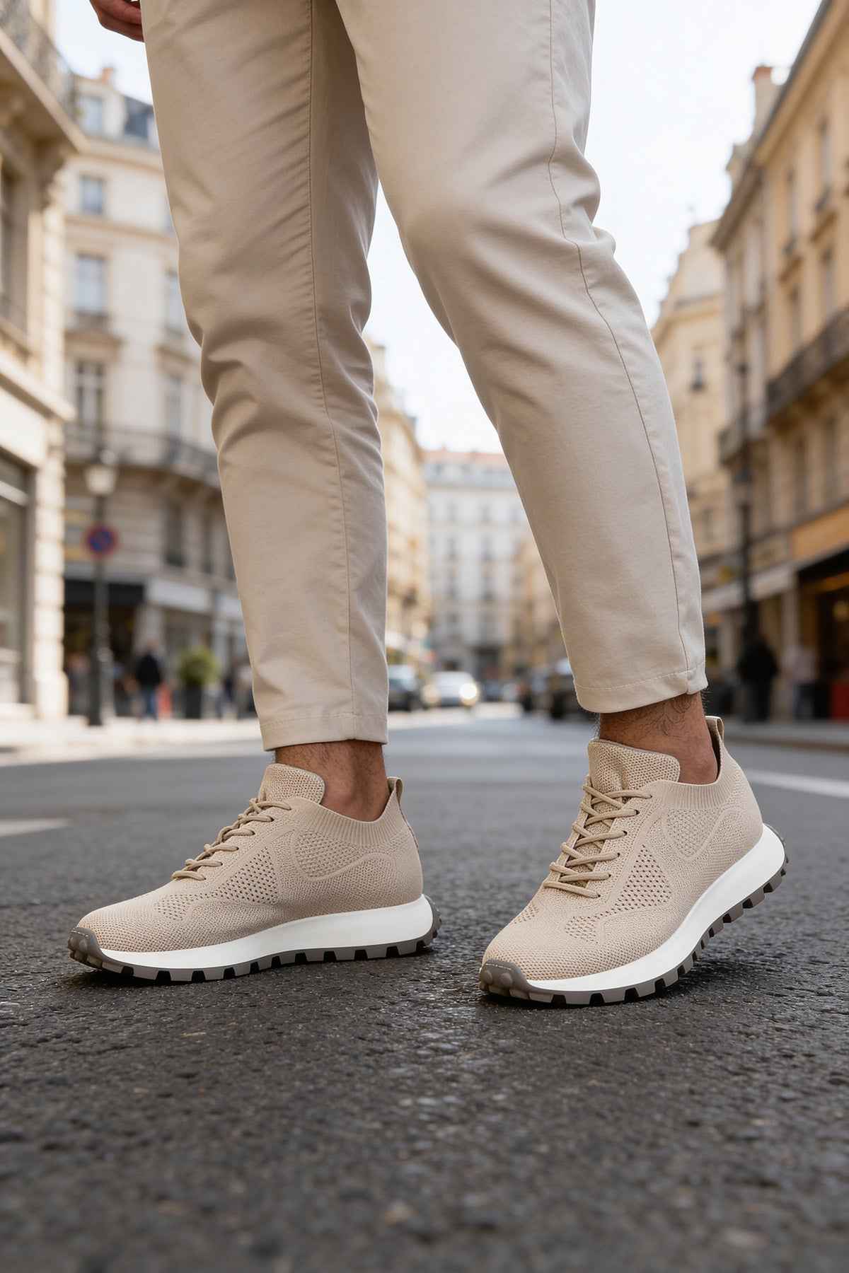Beige knit sneakers, side view with lace-up closure and treaded sole
