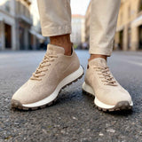 Beige knit lace-up sneakers with low profile sole and mesh-like texture