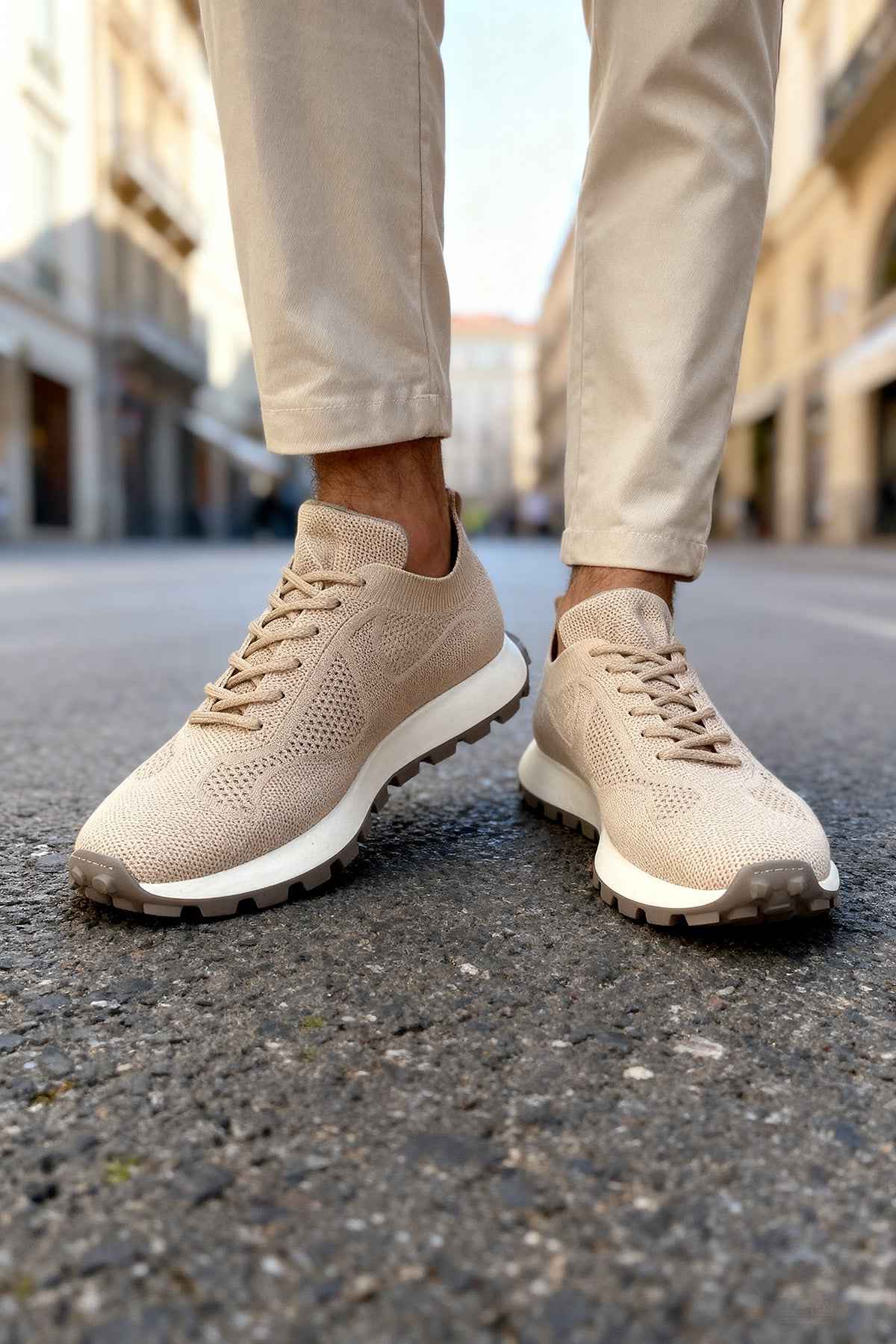 Beige knit lace-up sneakers with low profile sole and mesh-like texture