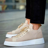 Beige knit sneakers with lace-up front and white rubber sole