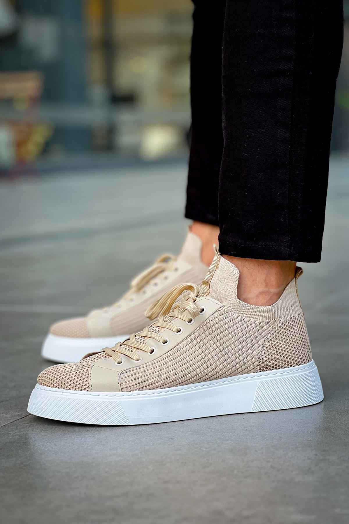 Beige knit sneakers with lace-up front and white rubber sole