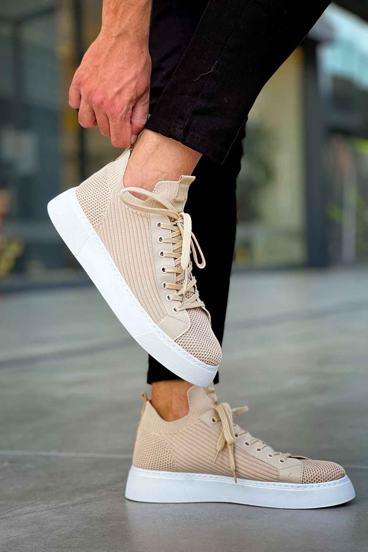 Beige knit lace-up sneakers with white sole, side view