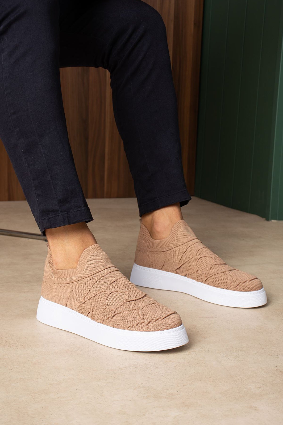 Beige knit slip-on sneakers with white rubber sole and wave stitch pattern