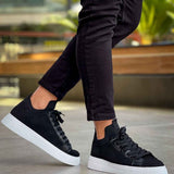 Men's black knit sneakers with low profile, lace-up design and white sole