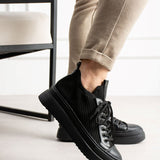 Black knit lace-up sneakers with side stripe detailing and chunky rubber outsole