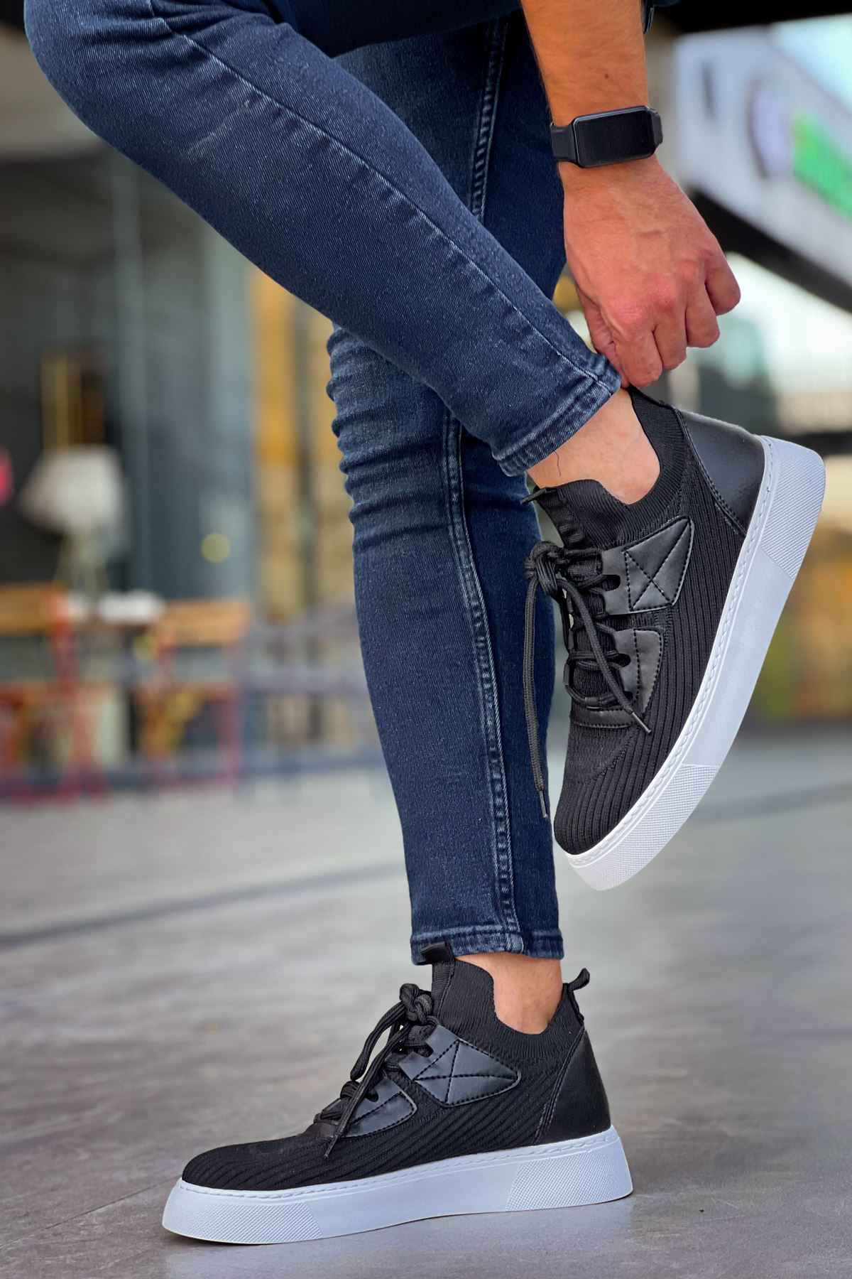 Men's knit black sneaker, lace-up with white midsole and breathable textured upper