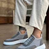 Gray knit slip-on sneakers with strap detail and white rubber sole
