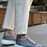 Gray knit sneakers with strap detail and low-profile white rubber sole