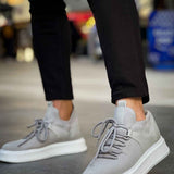 Light gray lace-up knit sneakers with white midsole, side view