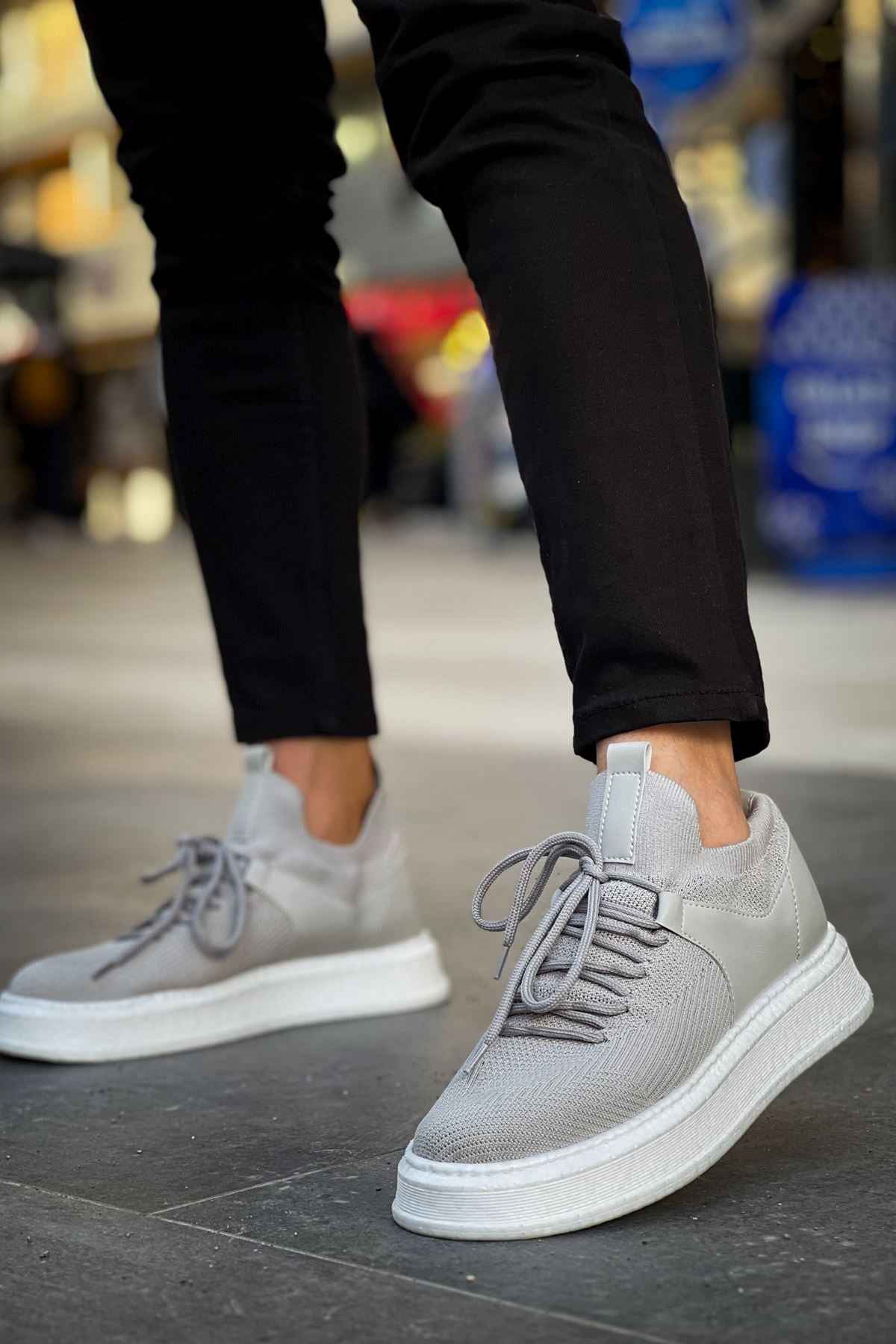 Light gray lace-up knit sneakers with white midsole, side view