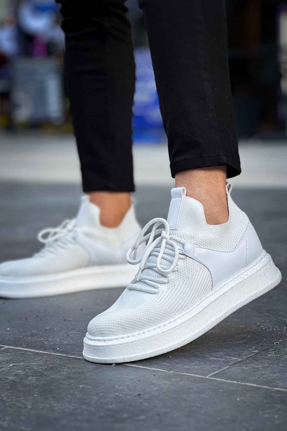 Men's knit white low-top sneakers with lace-up front and textured fabric