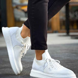 Knit lace-up sneakers in white with thick rubber sole and cushioned collar