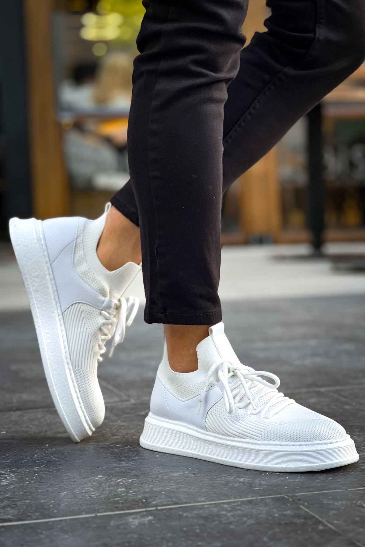 Knit lace-up sneakers in white with thick rubber sole and cushioned collar
