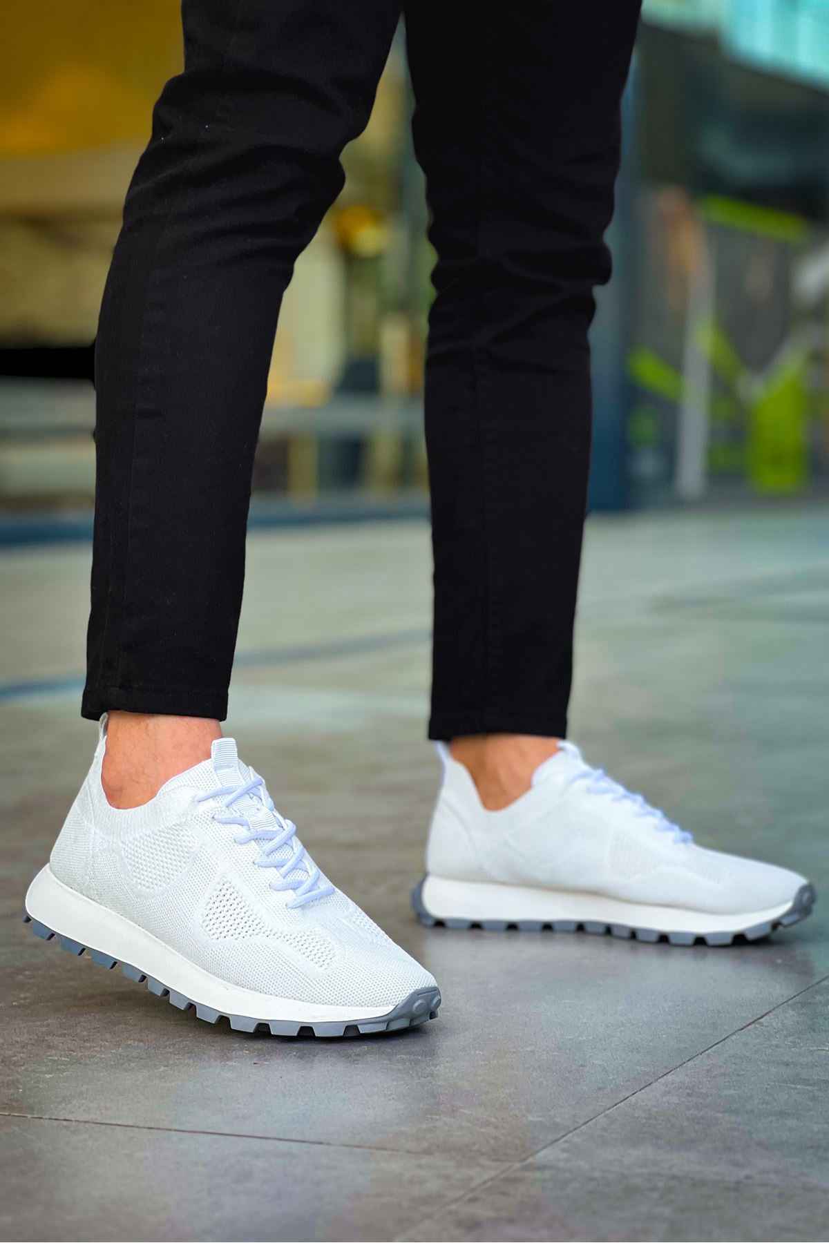 White knit low-top sneakers with lace-up vamp and chunky tread sole