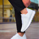White knit lace-up sneakers with thick tread sole, side view