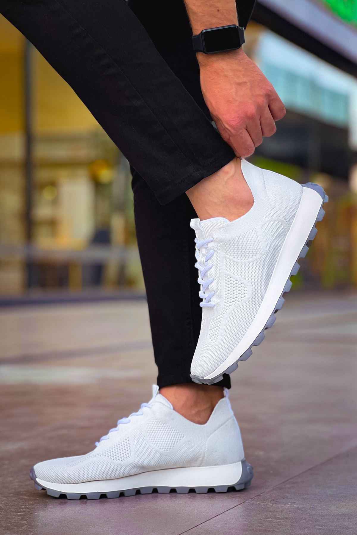 White knit lace-up sneakers with thick tread sole, side view