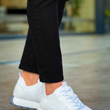 White knit lace-up sneakers with textured upper and treaded outsole