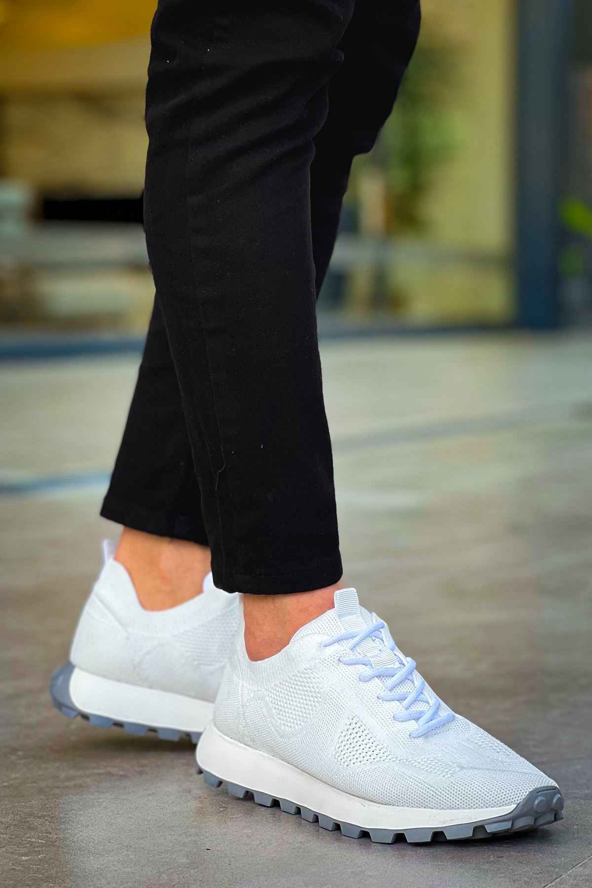 White knit lace-up sneakers with textured upper and treaded outsole
